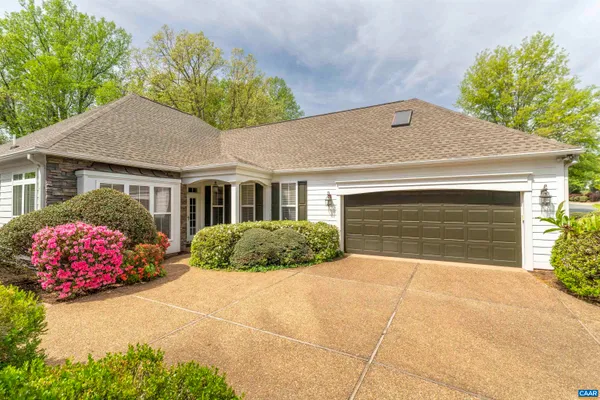 a front view of a house with a garage