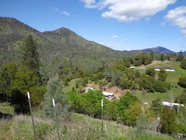 a view of a city with mountains in the background