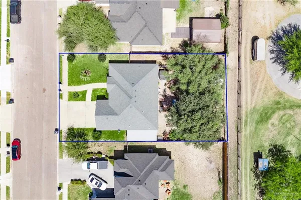 a view of a patio with table and chairs and potted plants