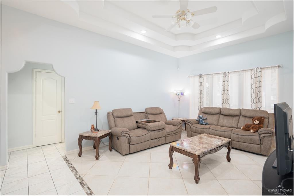 3006 Gabriel Street Mission, TX 78574 - Photo 22 of 34 a living room with furniture and a chandelier