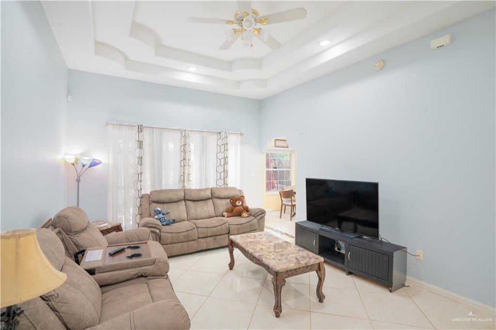 3006 Gabriel Street Mission, TX 78574 - Photo 23 of 34 a living room with furniture and a flat screen tv
