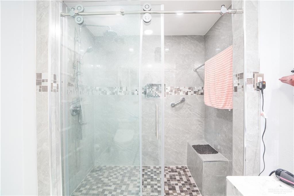 3006 Gabriel Street Mission, TX 78574 - Photo 31 of 34 a bathroom with a shower and a toilet