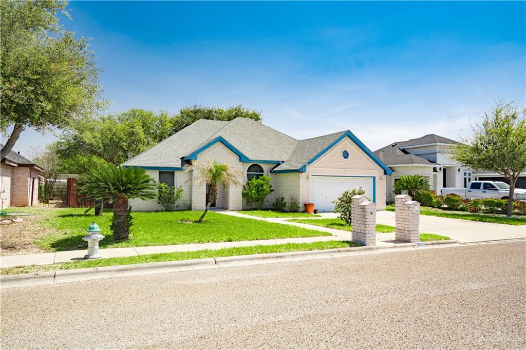3006 Gabriel Street Mission, TX 78574 - Photo 4 of 34 a front view of a house with a yard and garage