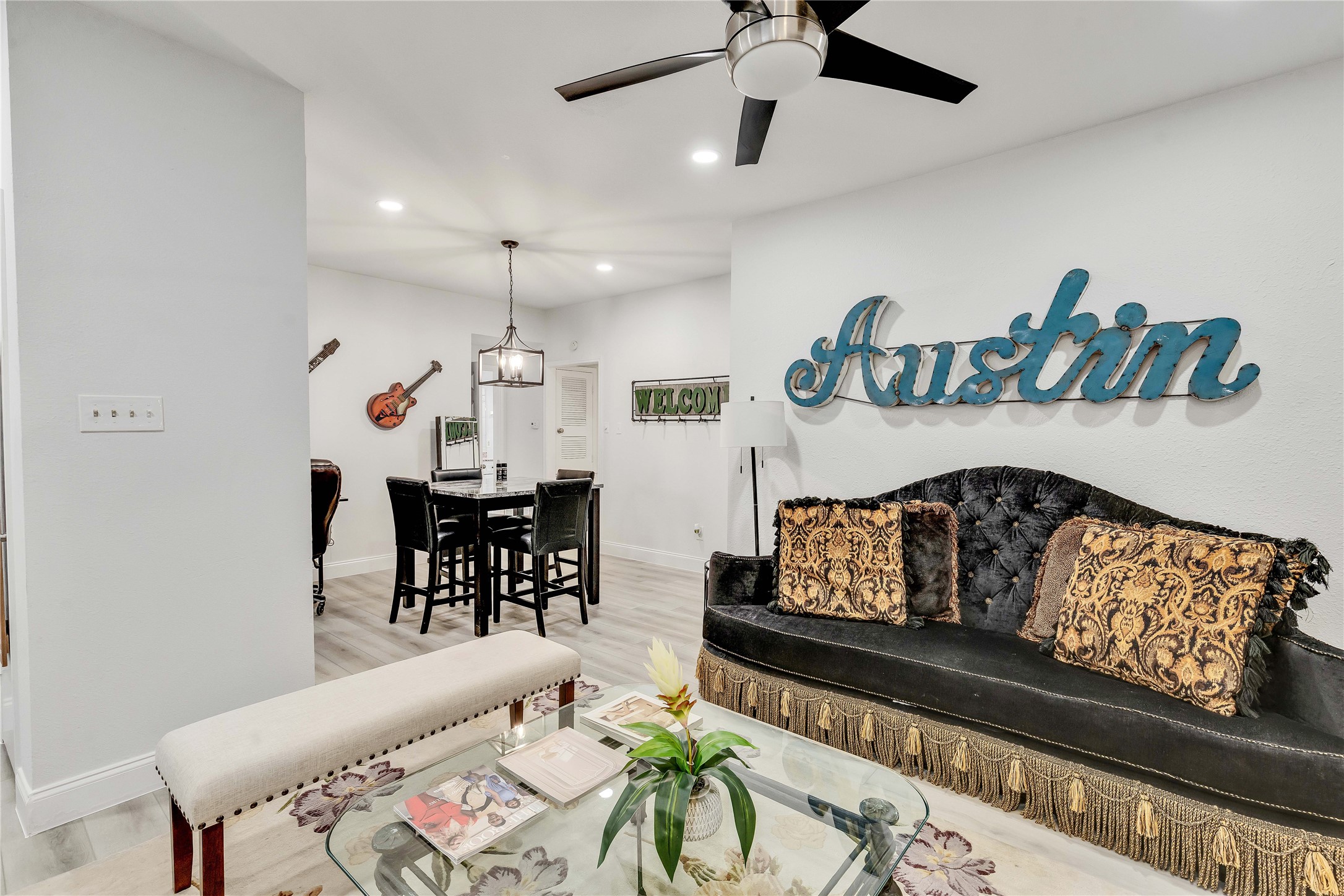 2529 Rio Grande Street, Unit 56 Austin, TX 78705 - Photo 9 of 16 Living area featuring ceiling fan, light wood-style flooring, baseboards, and recessed lighting