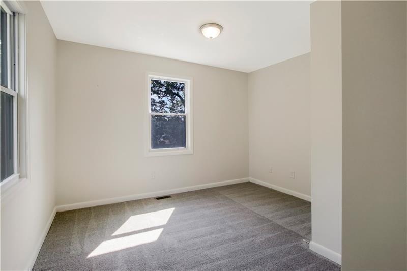 551 Valley Hill Road Southeast, Unit A Riverdale, GA 30274 - Photo 15 of 42 an empty room with a window