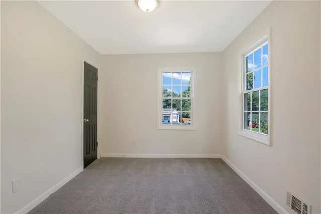 an empty room with windows