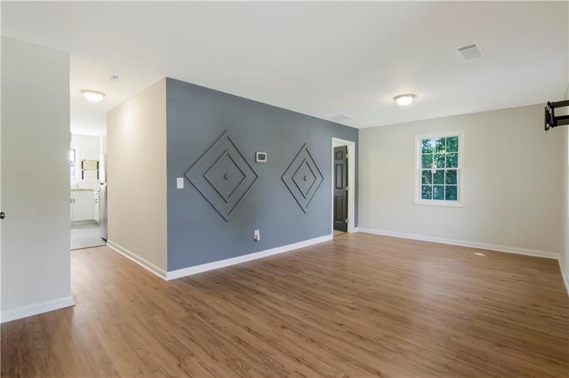 551 Valley Hill Road Southeast, Unit A Riverdale, GA 30274 - Photo 20 of 42 a view of empty room with wooden floor