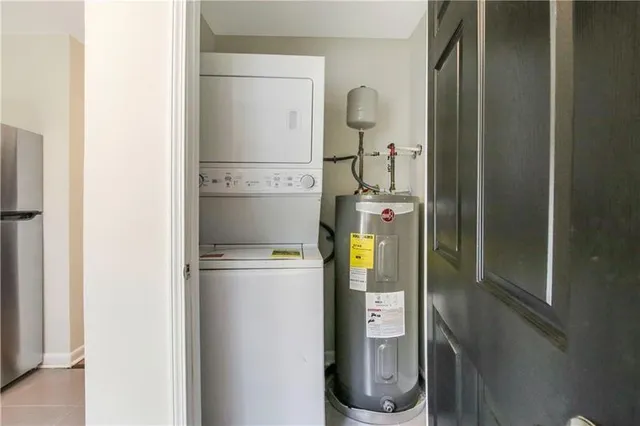 a room with water heater and a cabinet