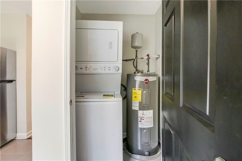 551 Valley Hill Road Southeast, Unit A Riverdale, GA 30274 - Photo 28 of 42 a room with water heater and a cabinet