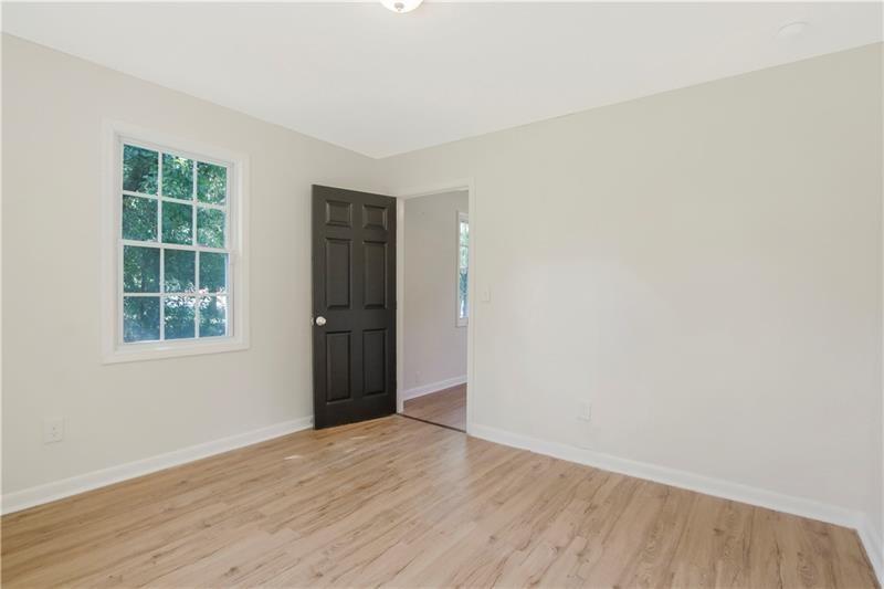 551 Valley Hill Road Southeast, Unit A Riverdale, GA 30274 - Photo 30 of 42 an empty room with windows and entrance