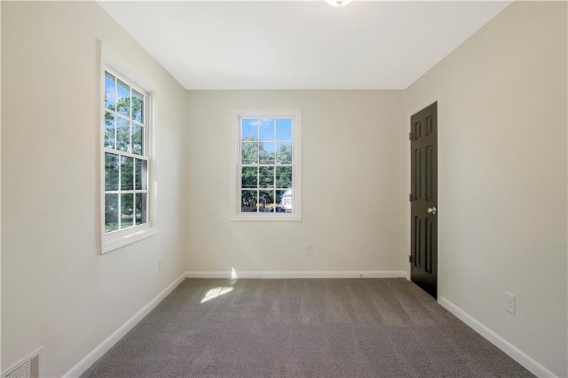 551 Valley Hill Road Southeast, Unit A Riverdale, GA 30274 - Photo 32 of 42 an empty room with windows