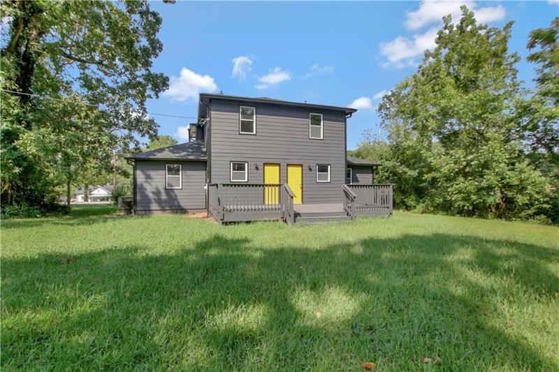 551 Valley Hill Road Southeast, Unit A Riverdale, GA 30274 - Photo 42 of 42 a view of a house with a backyard