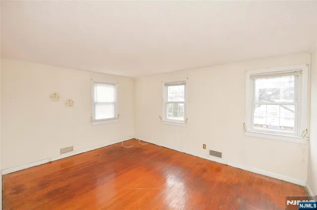 a view of a bedroom with a window