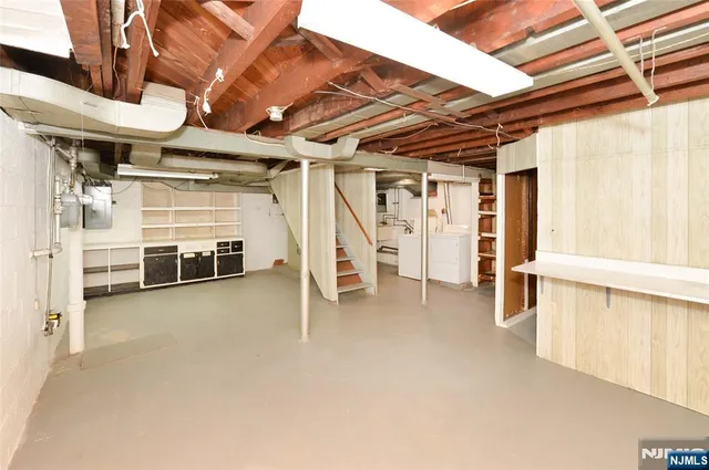 a view of an empty room with white walls