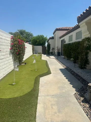 a living room with furniture fireplace and a large window