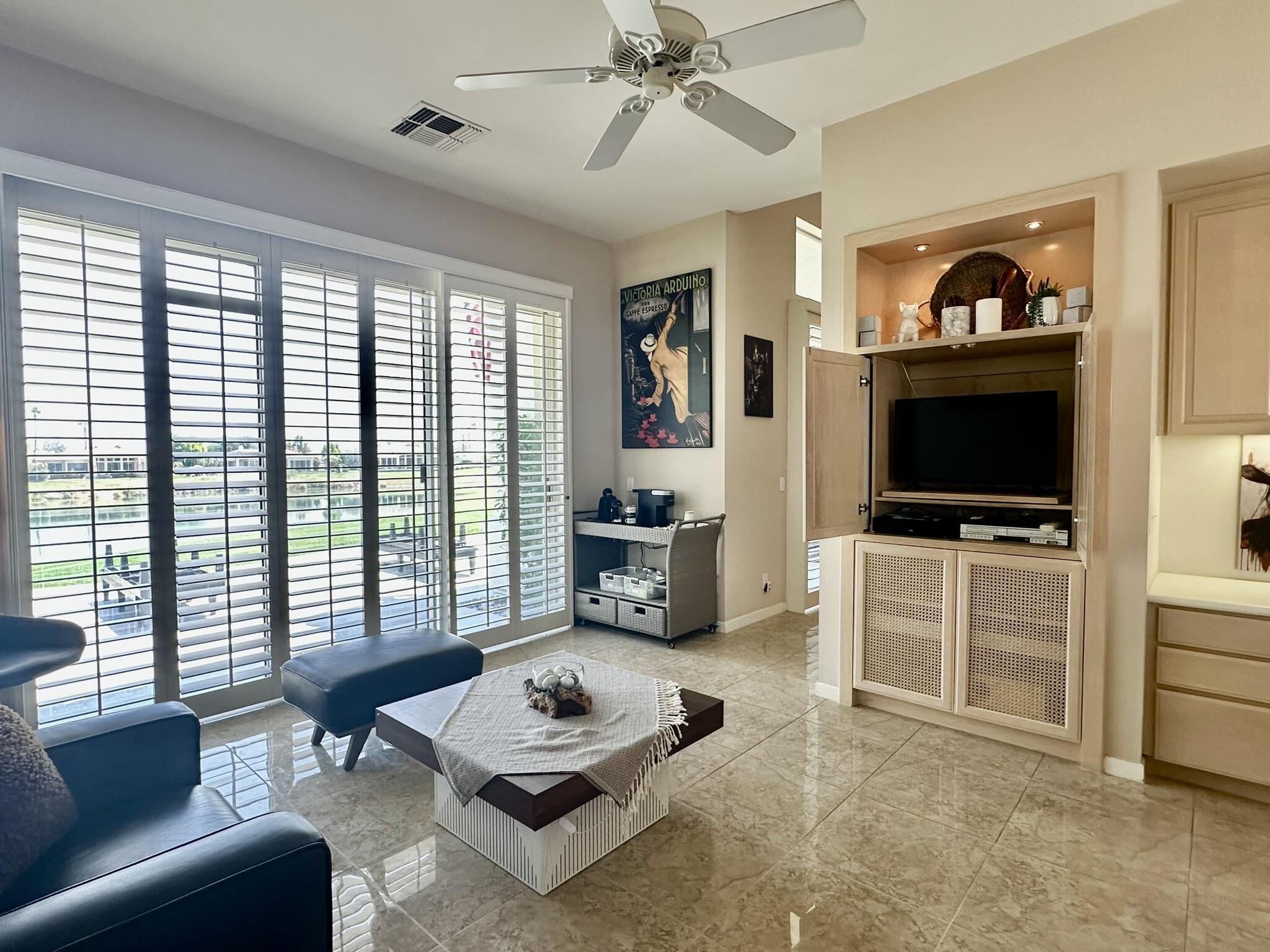 57600 Interlachen La Quinta, CA 92253 - Photo 11 of 33 a living room with furniture and a flat screen tv