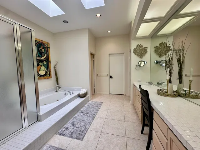 a view of a house with backyard sitting area and garden