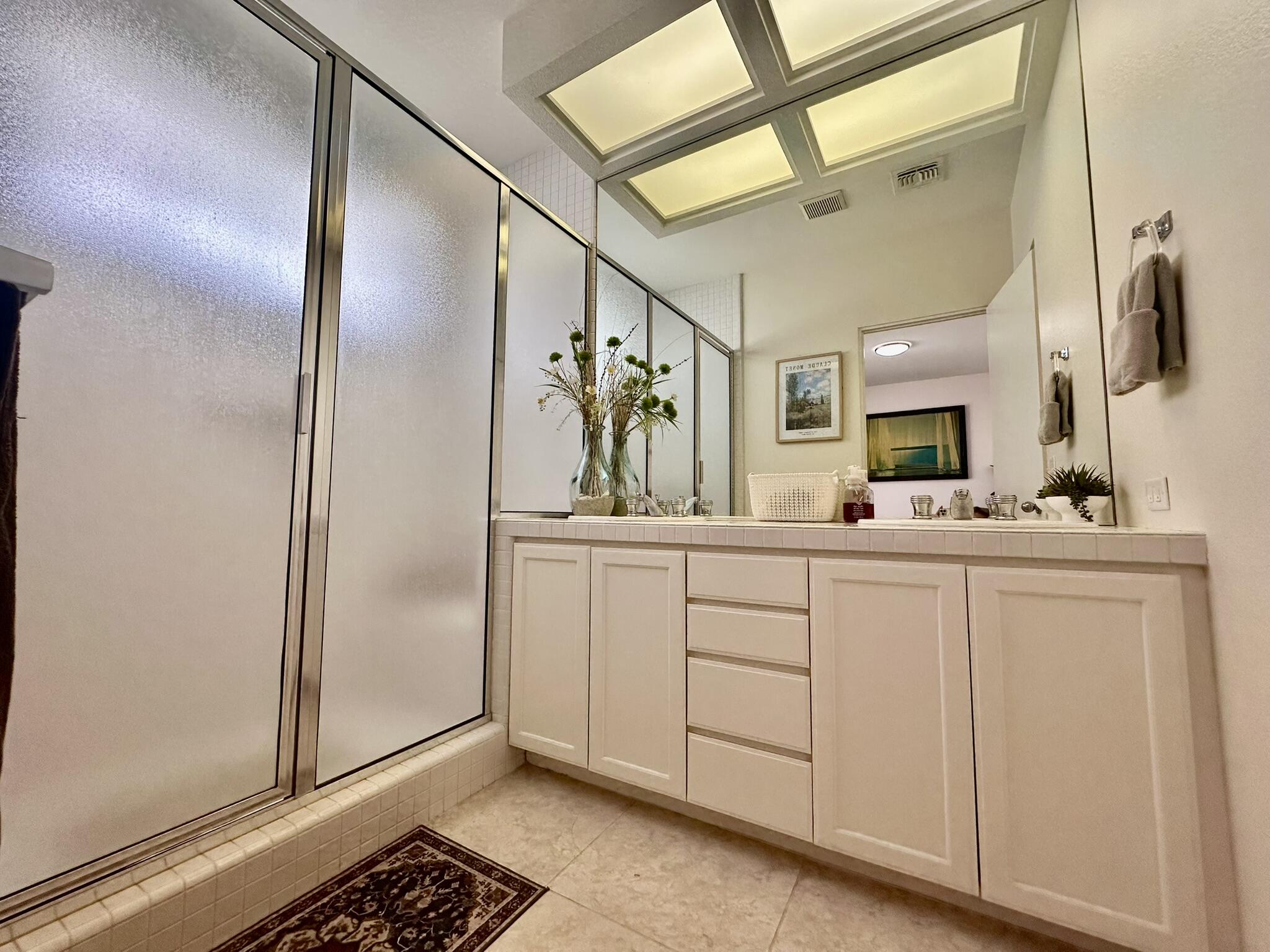 57600 Interlachen La Quinta, CA 92253 - Photo 21 of 33 a bathroom with a sink and a mirror