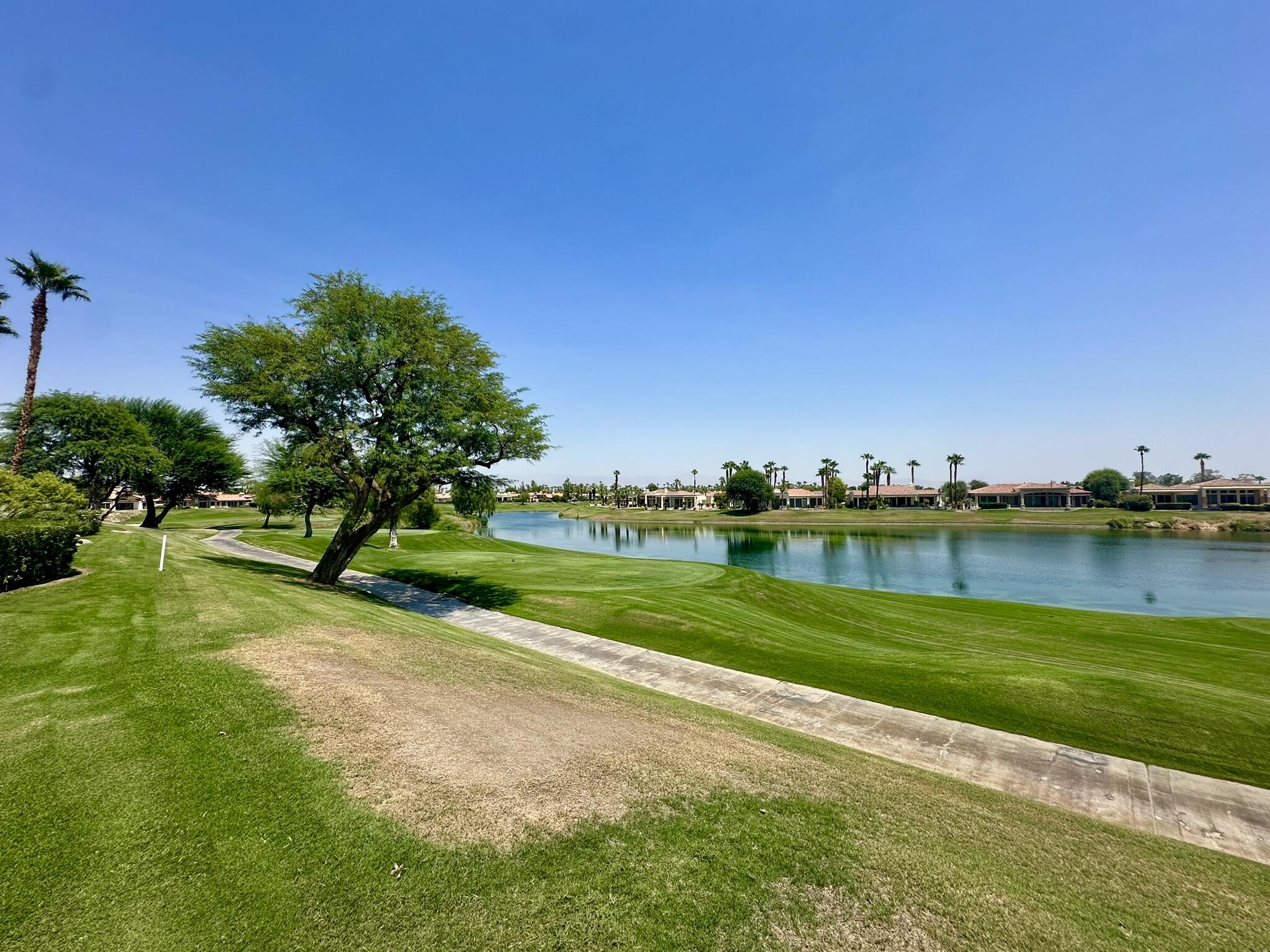 57600 Interlachen La Quinta, CA 92253 - Photo 29 of 33 a view of a golf course with a lake view