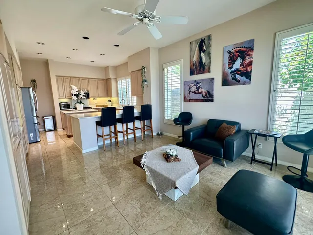 a toilet sitting in a bathroom next to a wooden wall