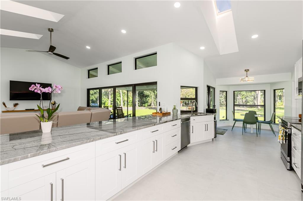 3511 17th Avenue Southwest Naples, FL 34117 - Photo 32 of 32 a large white kitchen with large windows and a large window