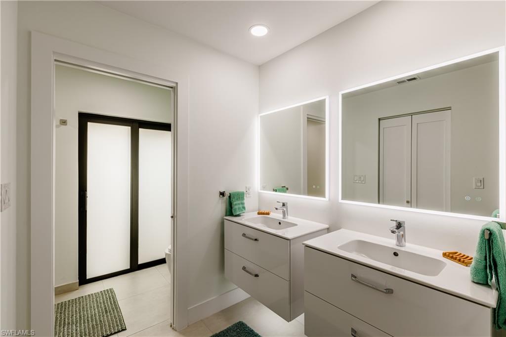 3511 17th Avenue Southwest Naples, FL 34117 - Photo 15 of 32 a bathroom with a double vanity sink mirror and
