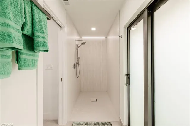 a bathroom with a double vanity sink mirror and