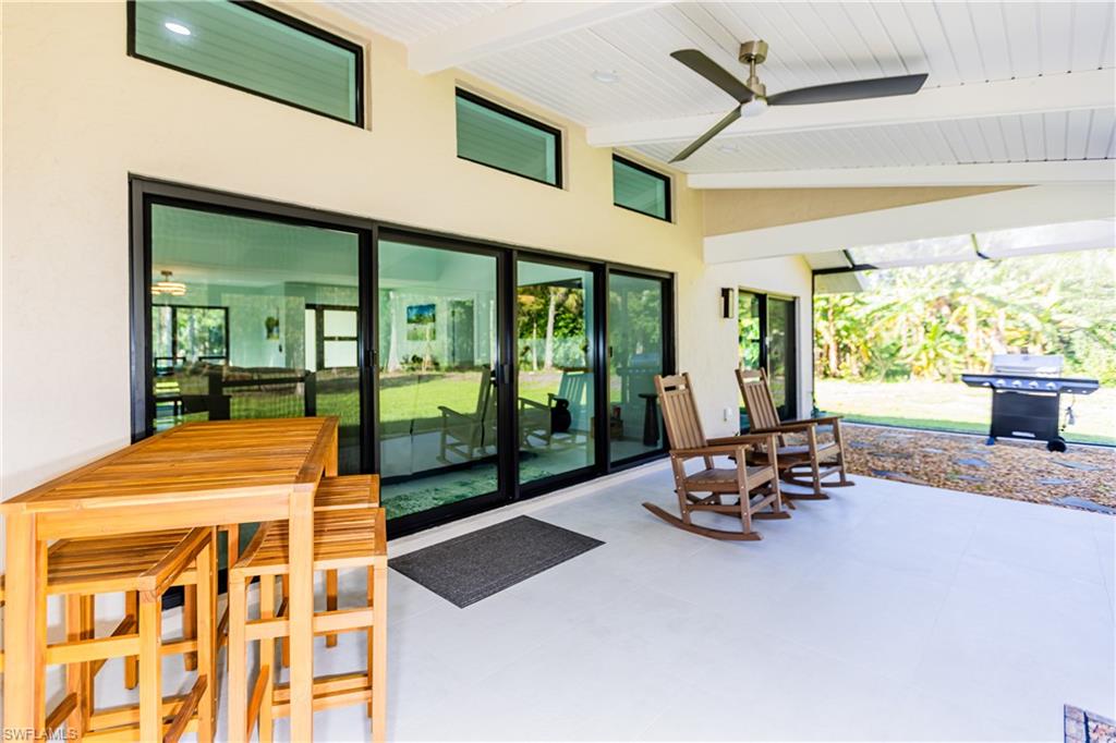 3511 17th Avenue Southwest Naples, FL 34117 - Photo 24 of 32 a dining room with a large window
