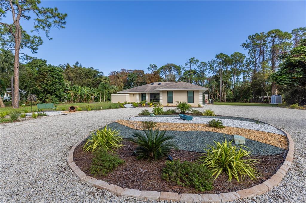 3511 17th Avenue Southwest Naples, FL 34117 - Photo 2 of 32 a view of a swimming pool with a patio
