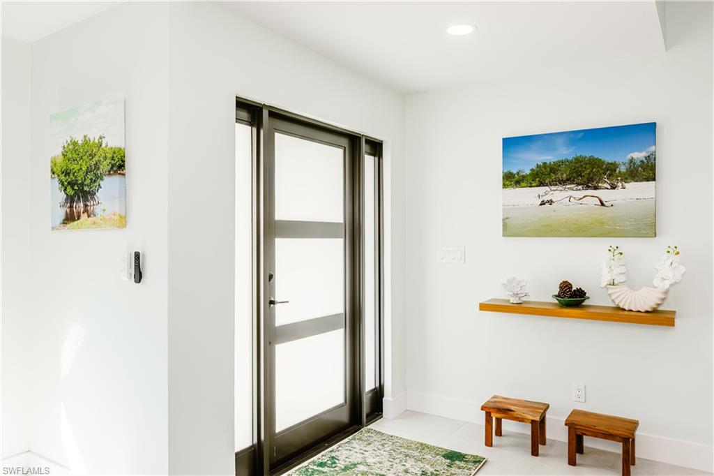 3511 17th Avenue Southwest Naples, FL 34117 - Photo 5 of 32 a painting on the wall next to a window