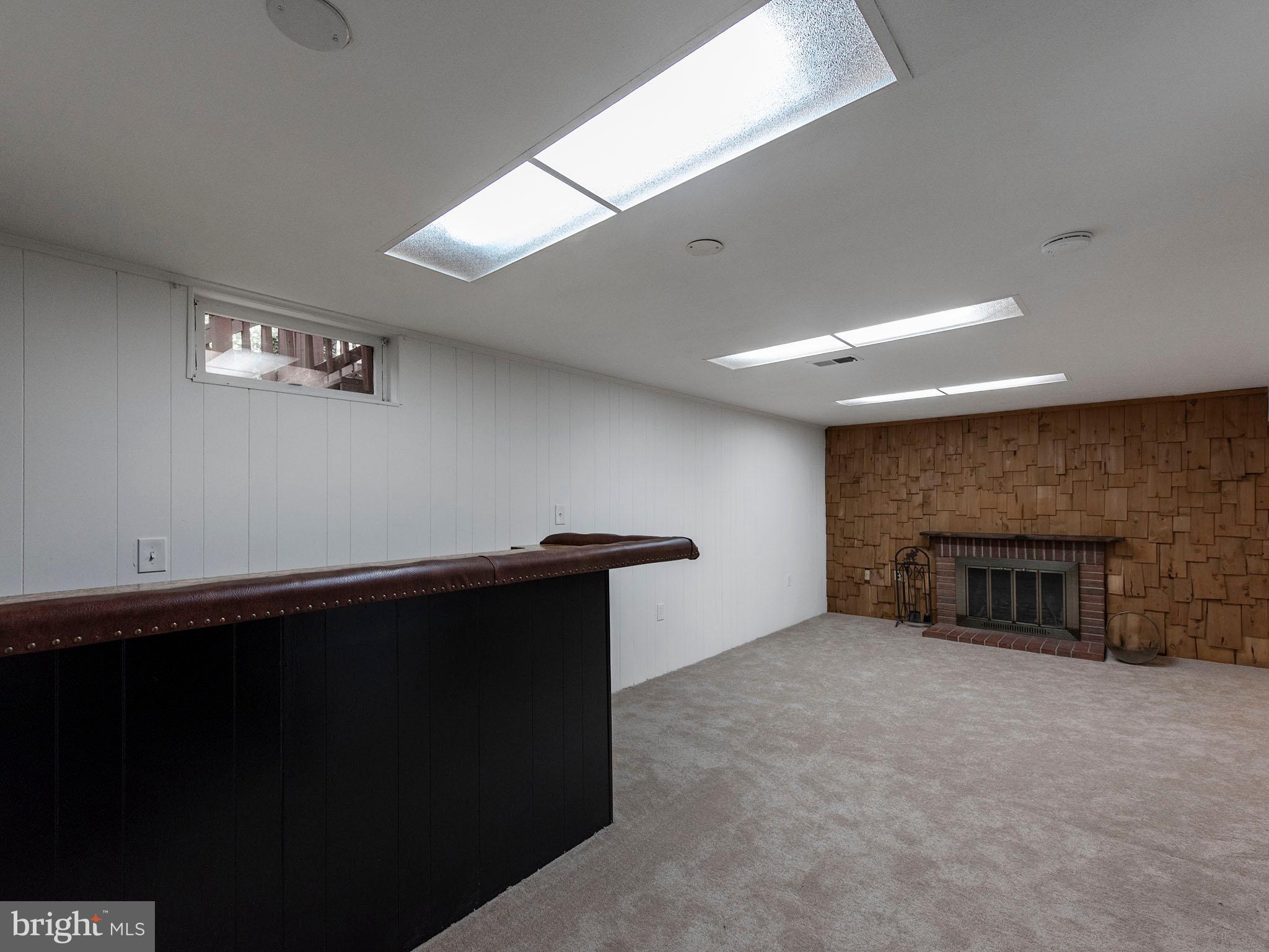 2360 Old Trail Drive Reston, VA 20191 - Photo 20 of 40 Basement wet bar and wood burning fireplace