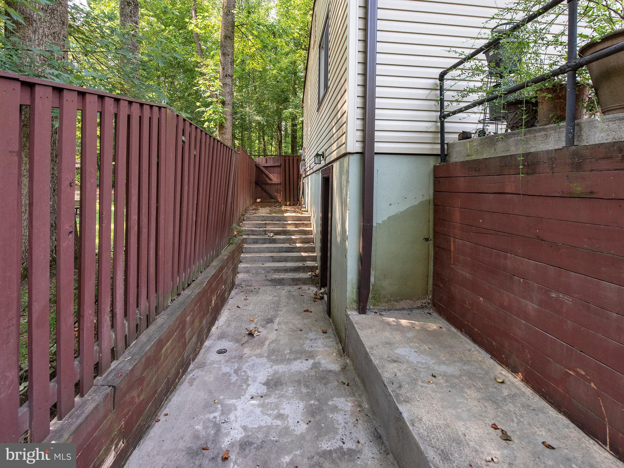 2360 Old Trail Drive Reston, VA 20191 - Photo 30 of 40 Left side of the house with laundry door entrance