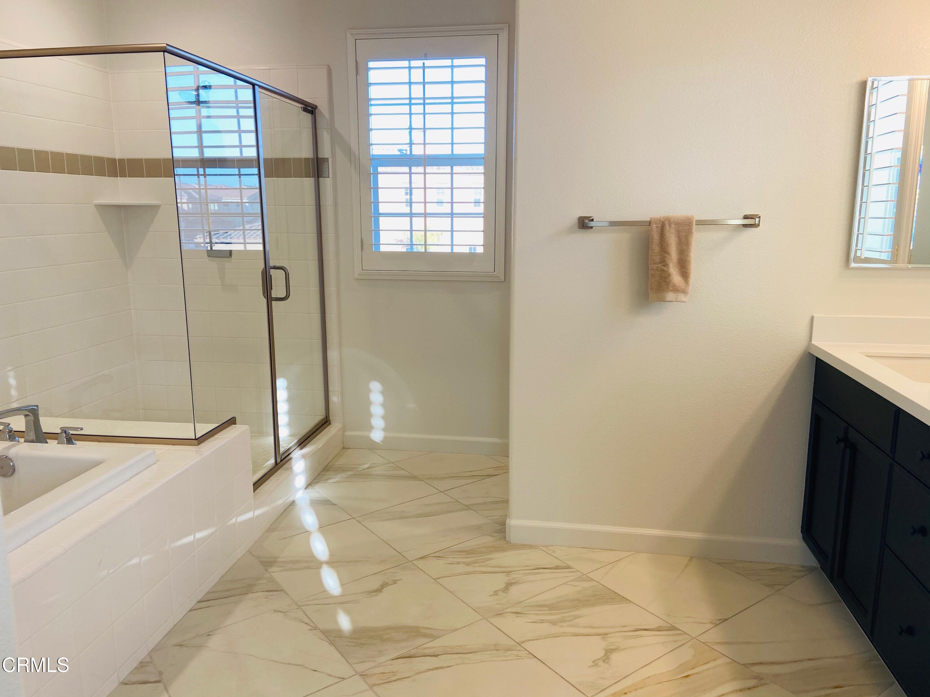 1645 Range Road Oxnard, CA 93036 - Photo 19 of 34 a bathroom with a bathtub and a shower