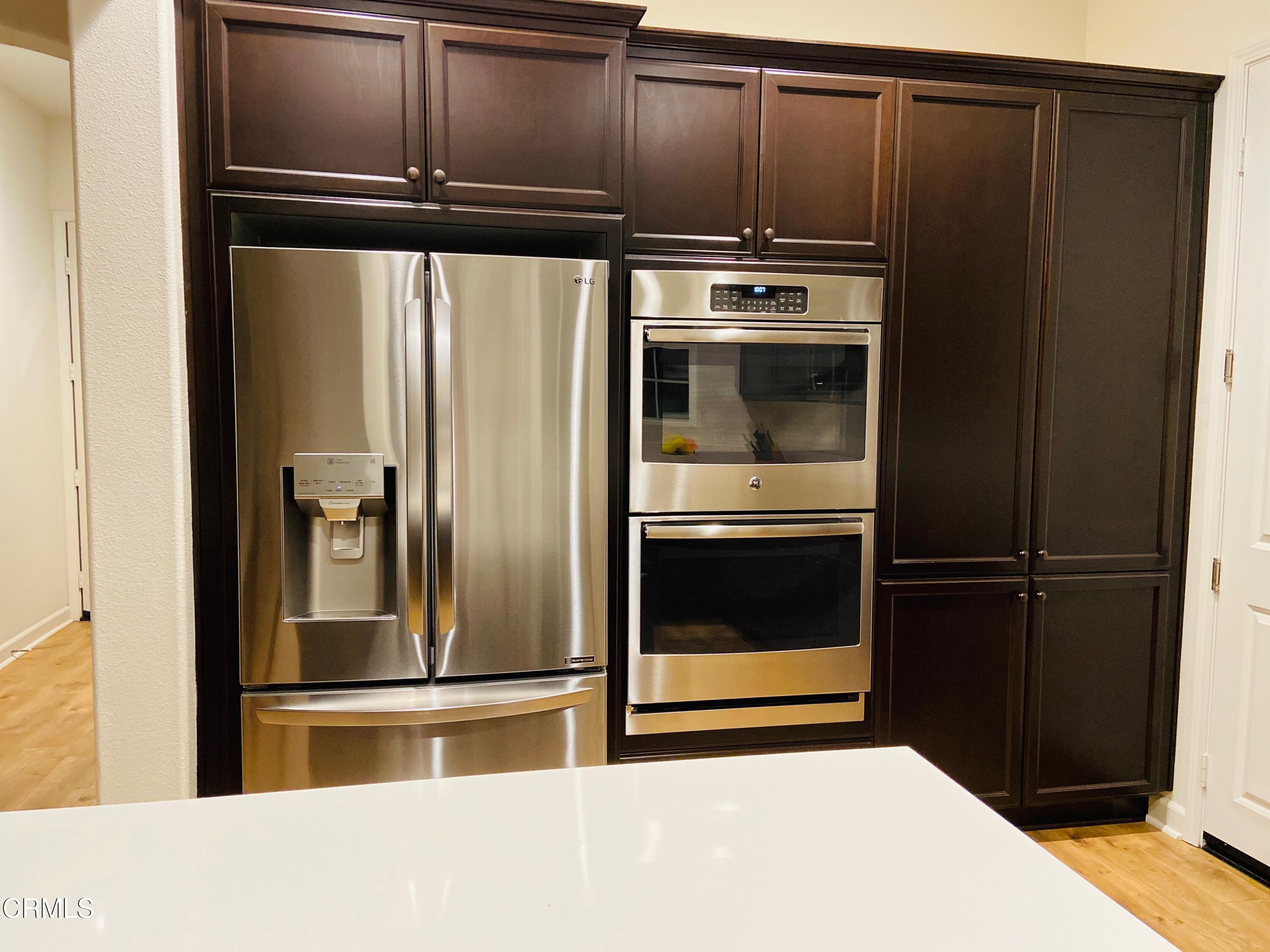 1645 Range Road Oxnard, CA 93036 - Photo 3 of 34 a metallic refrigerator freezer sitting in a kitchen