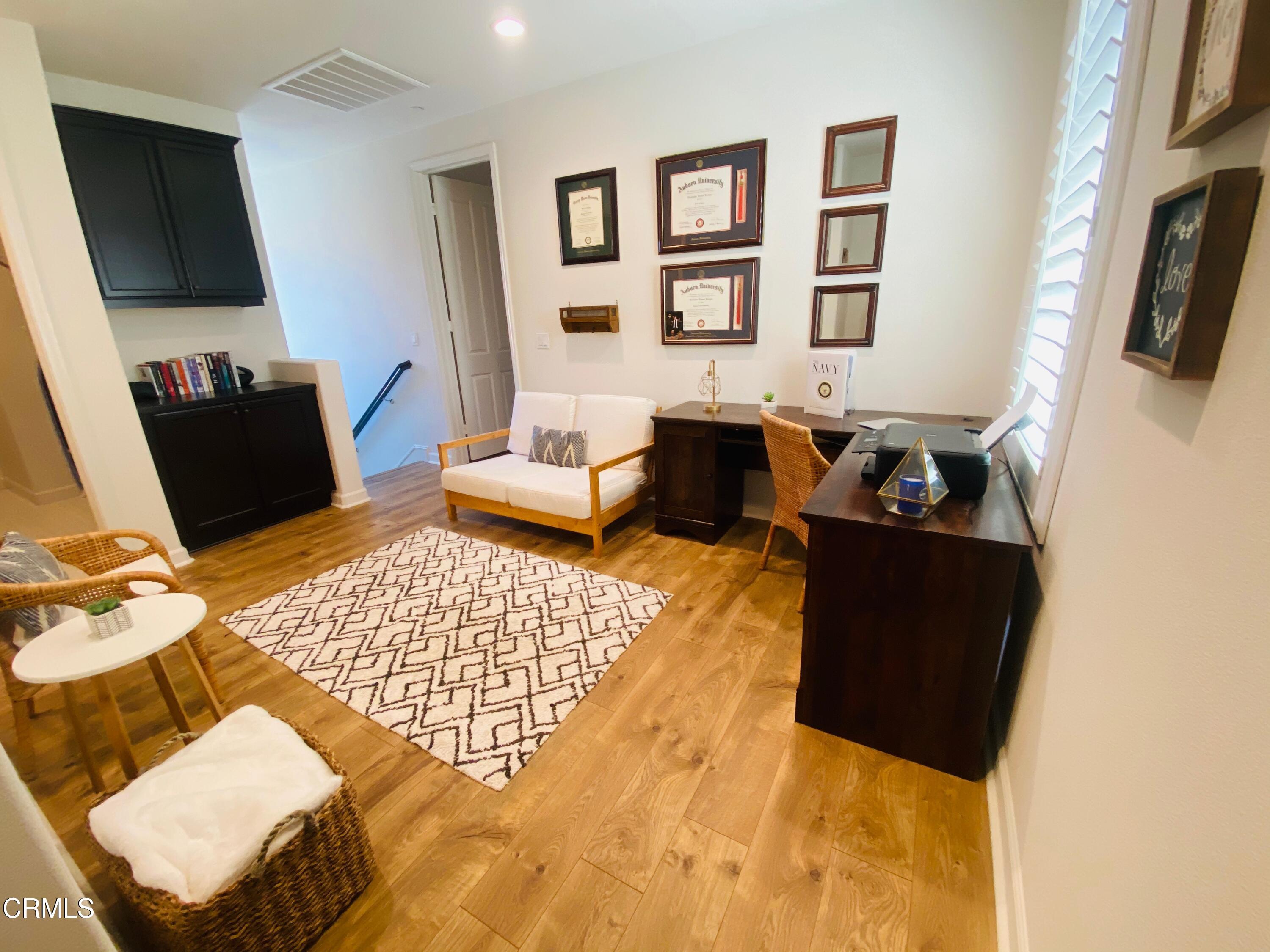 1645 Range Road Oxnard, CA 93036 - Photo 9 of 34 a living room with furniture and a flat screen tv