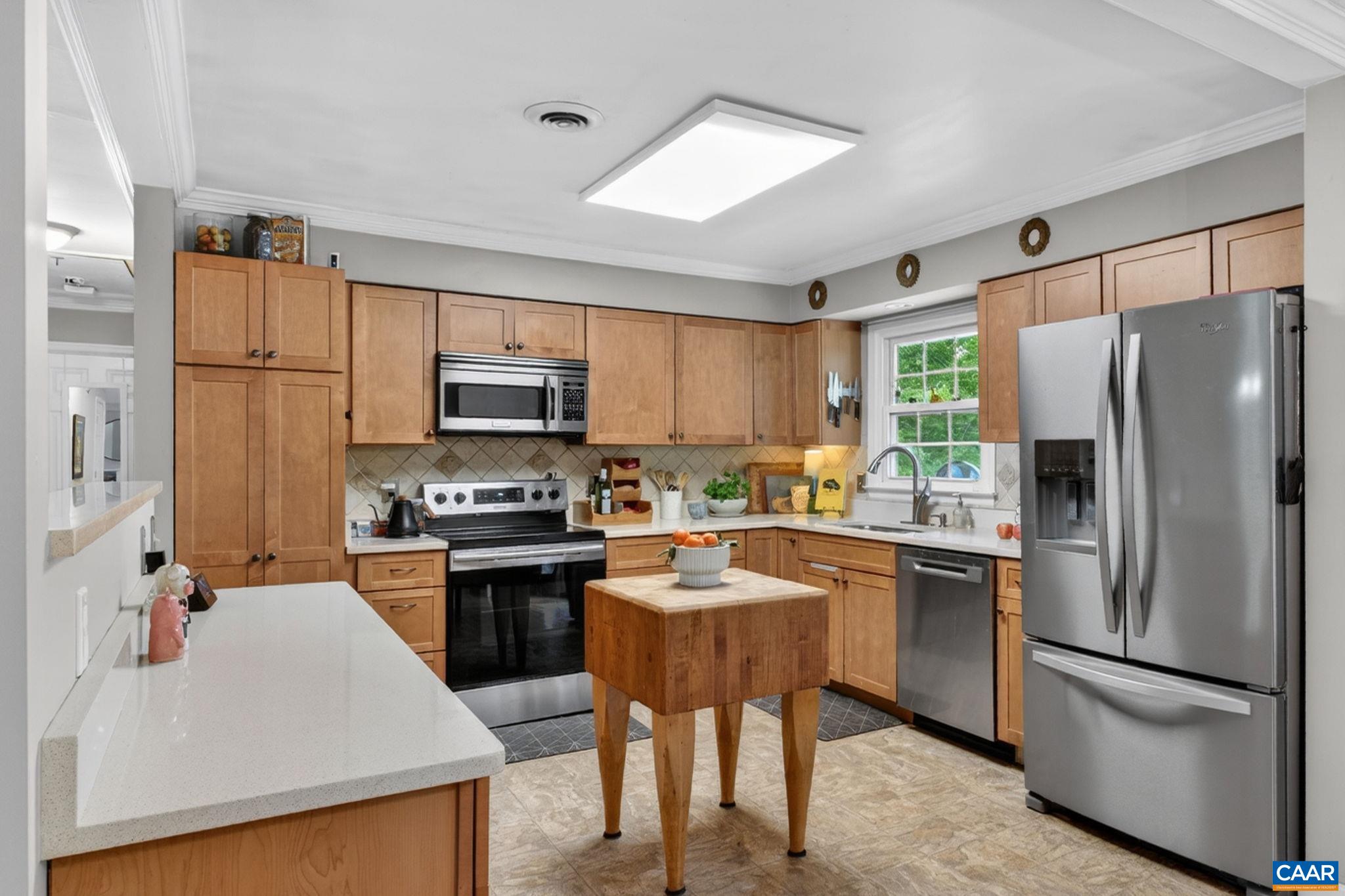 2520 Huntington Road Charlottesville, VA 22901 - Photo 11 of 39 Maple cabinets, Corian