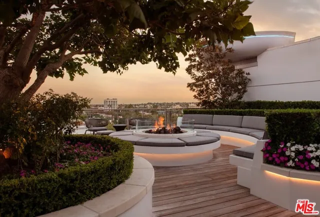 a view of a terrace with couches and potted plants