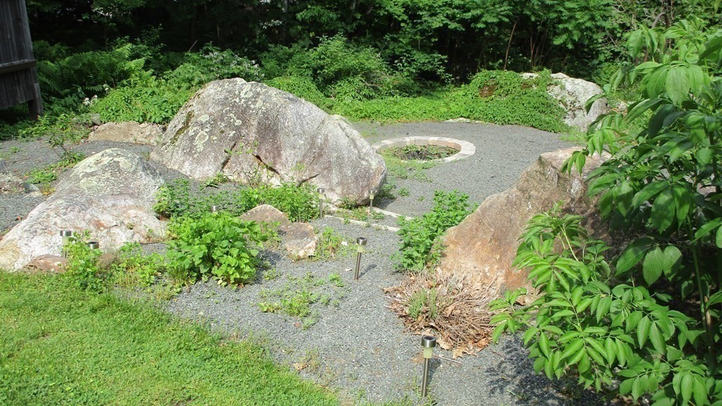 52 Pine Ridge Road Montgomery, MA 01085 - Photo 32 of 39 a view of a garden with a fountain