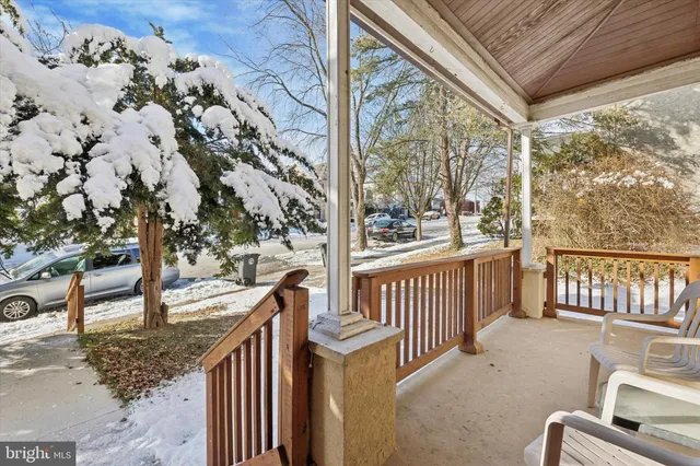a view of a porch with wooden floor and fence