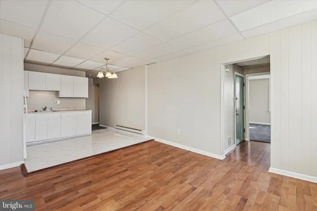 a view of a kitchen with wooden floor