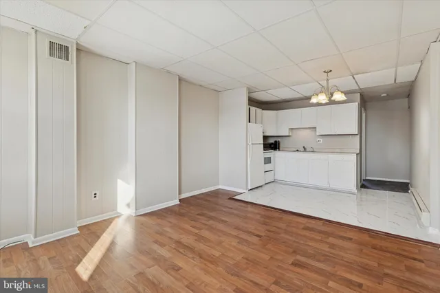 a view of a livingroom with a kitchen