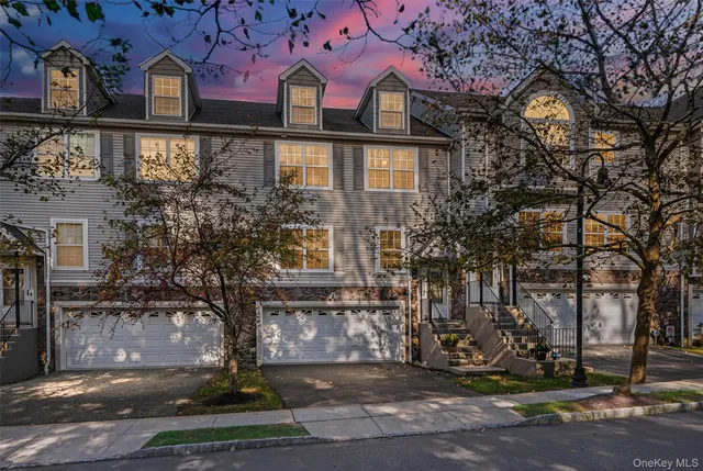 a view of a brick building next to a yard
