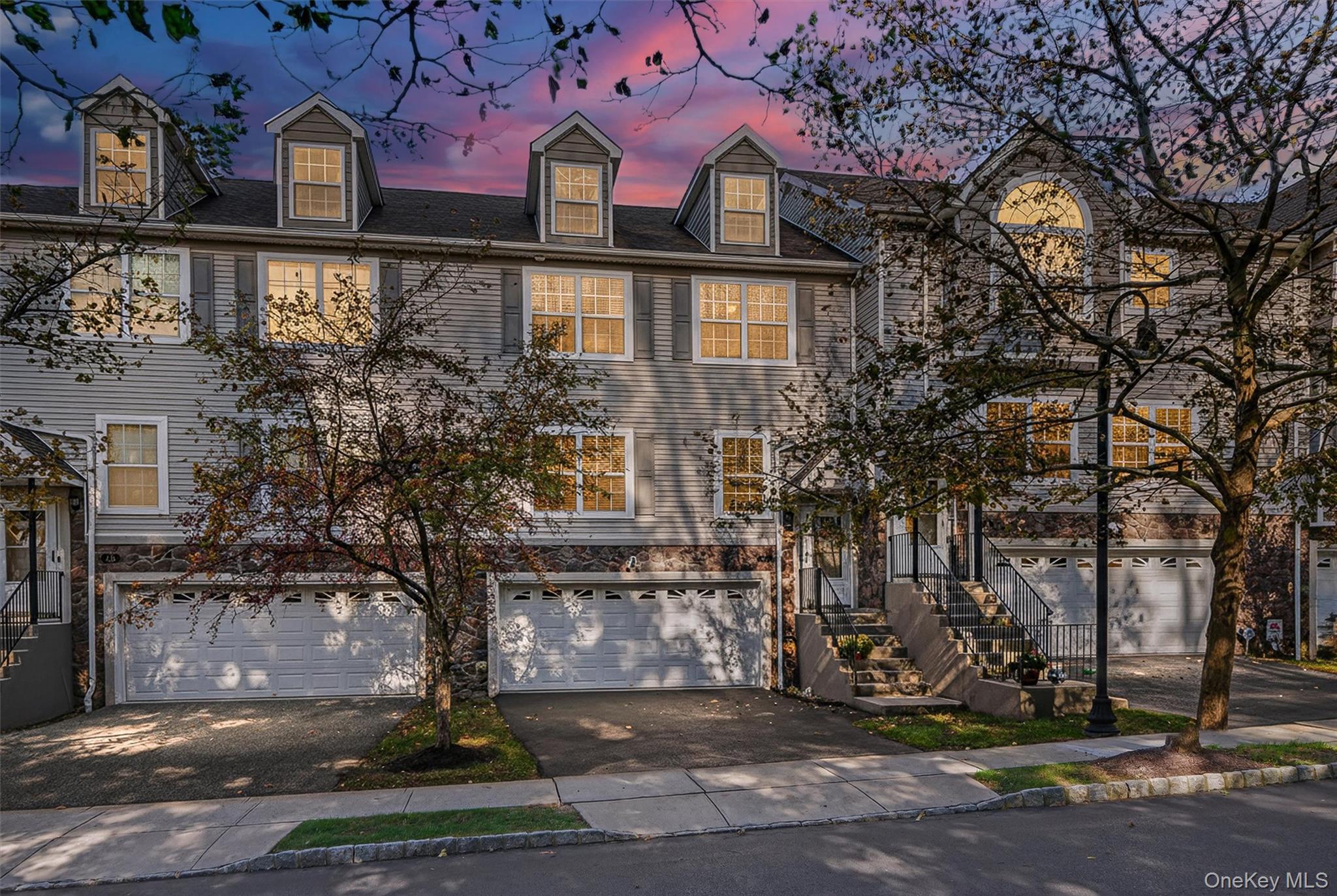 a view of a brick building next to a yard