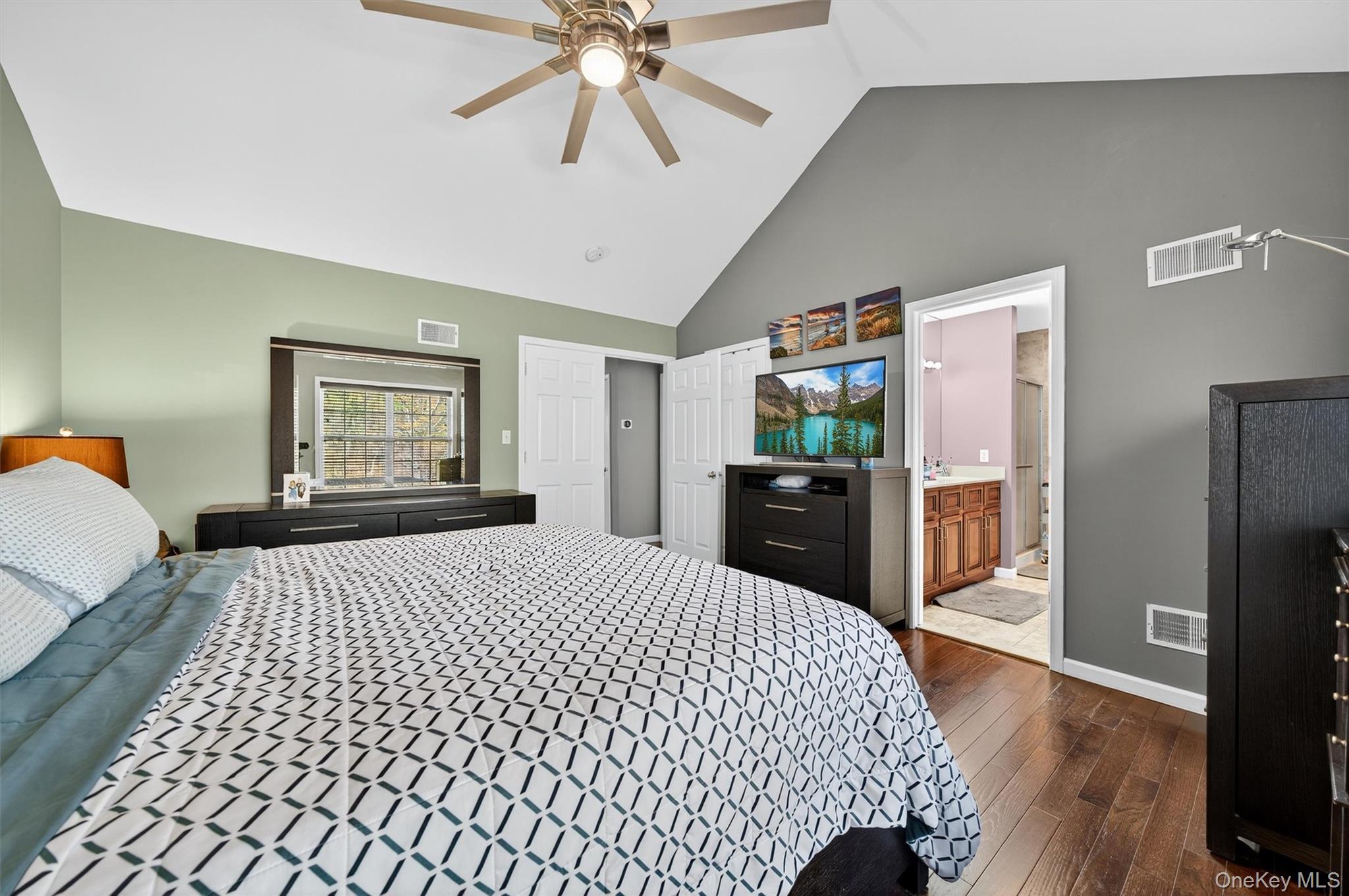 26 Peter Turner Road Monroe, NY 10950 - Photo 27 of 47 a bedroom with a bed and a chandelier