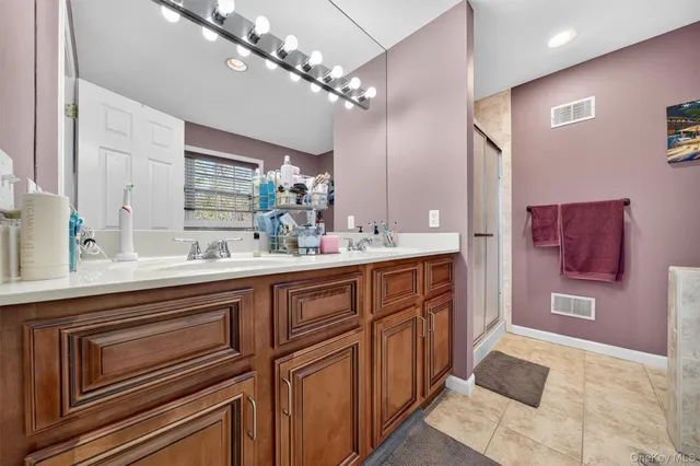 a bathroom with a shower and a sink