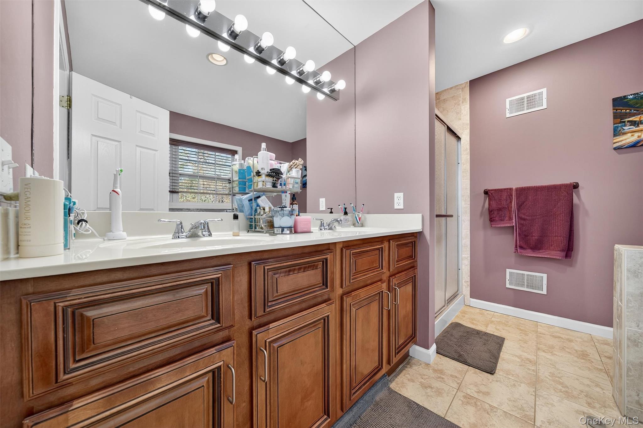 26 Peter Turner Road Monroe, NY 10950 - Photo 28 of 47 a spacious bathroom with a double vanity sink a mirror and a bathtub