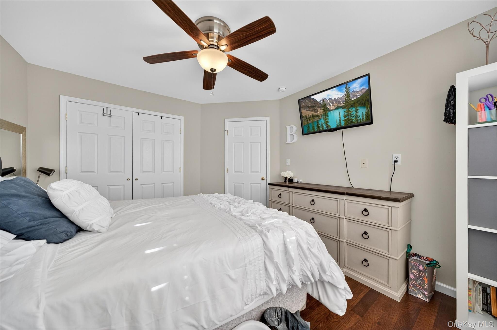 26 Peter Turner Road Monroe, NY 10950 - Photo 34 of 47 a bedroom with a large bed and a flat tv screen on dresser