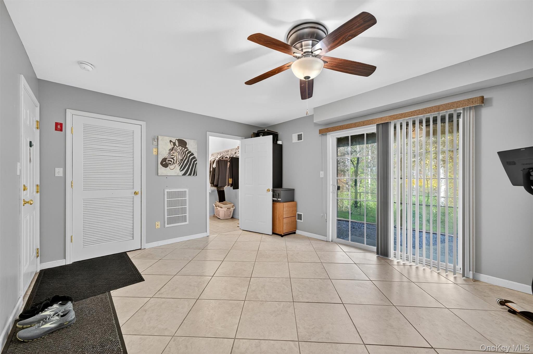 26 Peter Turner Road Monroe, NY 10950 - Photo 36 of 47 a view of a big room with windows and chandelier fan
