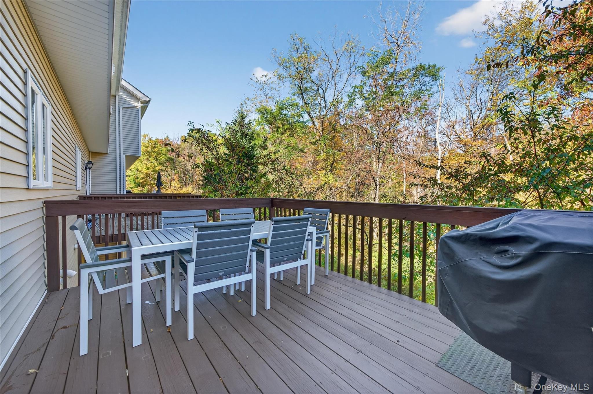 26 Peter Turner Road Monroe, NY 10950 - Photo 41 of 47 a balcony with wooden floor table and chairs