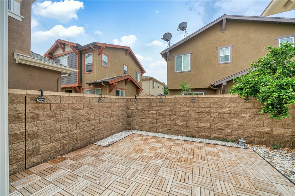311 Nimbus Tustin, CA 92782 - Photo 18 of 39 a view of a brick house with large windows